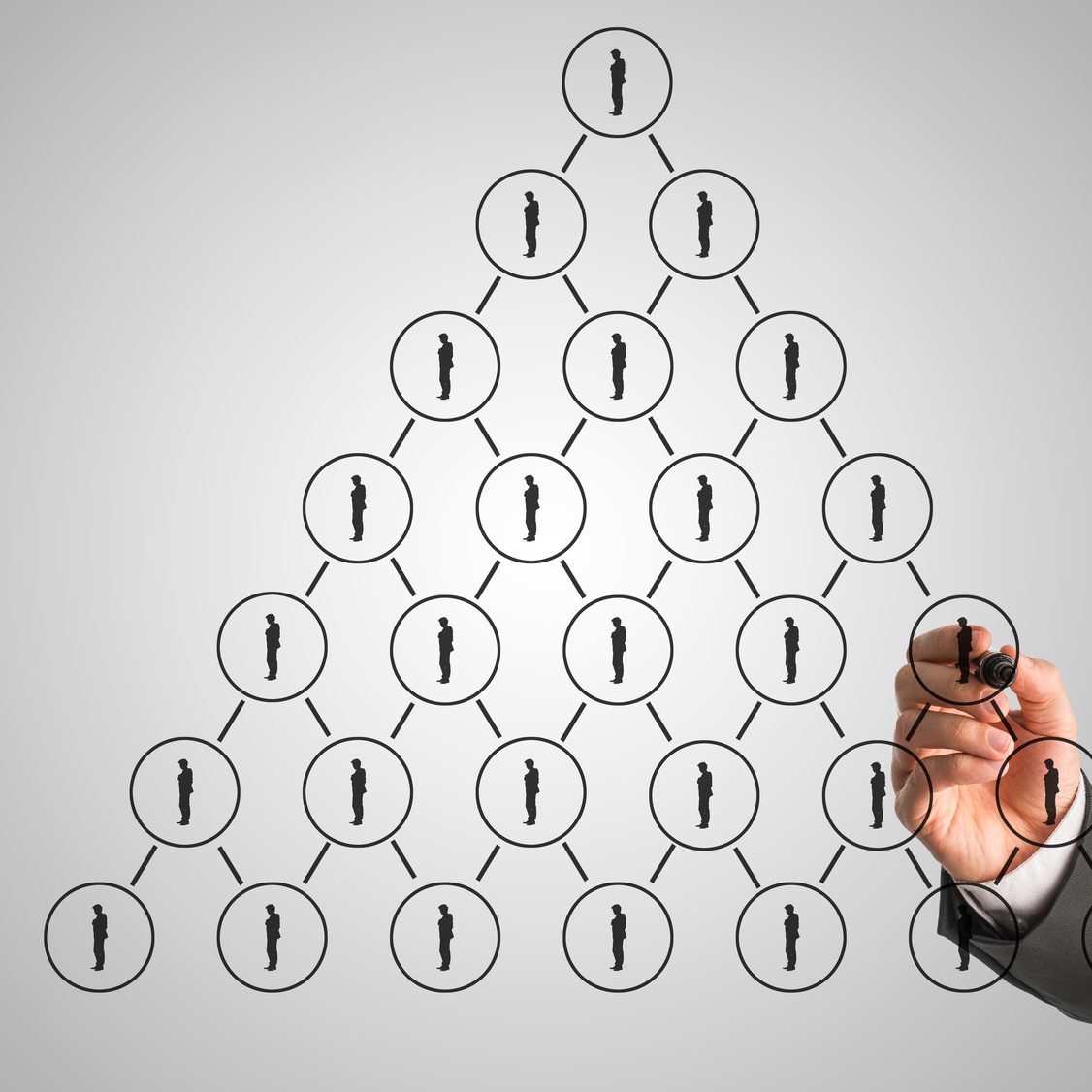 Businessman drawing a hierarchy concept on a virtual interface